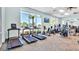 Well-equipped fitness center with large windows, treadmills, bikes and various exercise machines for a healthy lifestyle at 1970 Summer Dr, Davenport, FL 33897