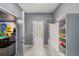 Inviting hallway with a built-in storage bench and a glimpse into a fun game room at 1970 Summer Dr, Davenport, FL 33897