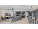 Bright, open floor plan featuring a living area, a dining area, and a modern kitchen with bar seating at 1970 Summer Dr, Davenport, FL 33897