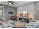 Comfortable living room with stylish decor, a large sectional sofa, and a decorative textured wall at 1970 Summer Dr, Davenport, FL 33897