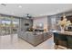 Spacious living room boasts an open floor plan, access to a patio, and easy access to the kitchen at 1970 Summer Dr, Davenport, FL 33897
