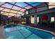 Beautiful private screened-in pool with spa and covered lanai with outdoor seating, perfect for entertaining at 1970 Summer Dr, Davenport, FL 33897