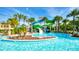 Resort-style pool with water slides and lush tropical landscaping at 1970 Summer Dr, Davenport, FL 33897