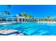 Large community pool with lounge chairs and umbrellas, perfect for relaxation at 1970 Summer Dr, Davenport, FL 33897