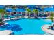Aerial view of large pool with lounge chairs and umbrellas at 1970 Summer Dr, Davenport, FL 33897