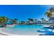 Large, beautiful community pool with sun loungers and umbrellas at 1970 Summer Dr, Davenport, FL 33897