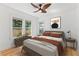 Tranquil bedroom featuring hardwood floors, neutral decor, and natural light from multiple windows at 205 W Princeton St, Orlando, FL 32804