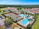 Aerial view of community amenities including pools, playground, tennis courts, clubhouse and residences at 2142 Victoria Dr, Davenport, FL 33837