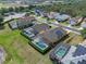 Aerial view of homes with screened-in pools in a residential neighborhood at 2142 Victoria Dr, Davenport, FL 33837