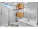 Bathroom with glass-enclosed shower, floating vanity, and spacious white counter at 2142 Victoria Dr, Davenport, FL 33837
