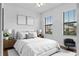 Stylish bedroom with large windows, neutral walls, and elegant furnishings at 2142 Victoria Dr, Davenport, FL 33837