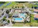 Aerial view of the community pool, tennis courts, playground, and clubhouse at 2142 Victoria Dr, Davenport, FL 33837