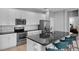 Well-equipped kitchen featuring a large island, stainless steel appliances, and modern cabinetry at 2142 Victoria Dr, Davenport, FL 33837