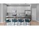 Modern kitchen featuring an island with barstool seating, stainless steel appliances, and pendant lighting at 2142 Victoria Dr, Davenport, FL 33837
