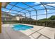 Screened-in pool with concrete decking provides a relaxing outdoor space at 2142 Victoria Dr, Davenport, FL 33837