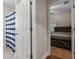 View from the bath to the bedroom featuring a wood bed frame and bamboo flooring at 216 S Holly Ave, Sanford, FL 32771