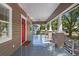 Spacious front porch offers a relaxing outdoor space and classic architectural details at 216 S Holly Ave, Sanford, FL 32771