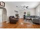 Comfortable living room with hardwood floors, a ceiling fan, and ample seating at 216 S Holly Ave, Sanford, FL 32771