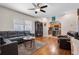 Inviting living area with hardwood floors and a seamless flow to the adjacent kitchen at 216 S Holly Ave, Sanford, FL 32771