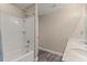 Bathroom featuring a tub and shower combo, sink, and wood-look tile flooring at 2211 Wadeview Loop, St Cloud, FL 34769