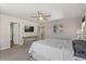 Relaxing bedroom featuring a plush bed, ceiling fan, and stylish decor, creating a restful space at 2211 Wadeview Loop, St Cloud, FL 34769