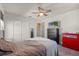 Well-lit bedroom offering natural light and ample space with a dresser and closet at 2211 Wadeview Loop, St Cloud, FL 34769
