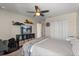 Relaxing bedroom featuring a comfortable bed, wall decor, and a well-lit space at 2211 Wadeview Loop, St Cloud, FL 34769
