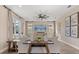 Spacious living room featuring neutral furniture, wood floors, and modern décor, providing a relaxing ambiance at 2211 Wadeview Loop, St Cloud, FL 34769