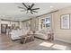 Open living area with neutral furniture, wood floors, bright lighting and backyard views at 2211 Wadeview Loop, St Cloud, FL 34769