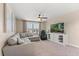 Comfortable living room with a plush sectional sofa, large window, and entertainment center at 2211 Wadeview Loop, St Cloud, FL 34769