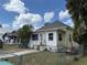 Exterior view of a white, one-story home with a small front yard and chain link fence at 232 S Clara Ave, Deland, FL 32720