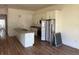 Updated kitchen with island, stainless appliances, granite countertops, and ample cabinet space at 232 S Clara Ave, Deland, FL 32720