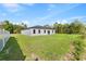 Expansive backyard featuring lush green grass and a privacy fence at 236 Marion Oaks Mnr, Ocala, FL 34473
