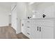 Bathroom with double sink vanity with quartz countertop and black hardware at 236 Marion Oaks Mnr, Ocala, FL 34473