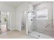 Elegant bathroom featuring a glass-enclosed shower with marble tile and modern fixtures at 236 Marion Oaks Mnr, Ocala, FL 34473