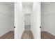Spacious walk-in closet features wood floors and metal shelving at 236 Marion Oaks Mnr, Ocala, FL 34473