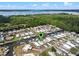 Real estate aerial shot featuring a waterfront community with boat docks on canal leading to beautiful Lake Eustis in Tavares, FL at 25931 Azalea Ln, Astatula, FL 34705