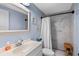Clean bathroom with a marble shower and blue walls at 25931 Azalea Ln, Astatula, FL 34705