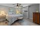 Cozy bedroom with a queen-sized bed, soft lighting, and simple decor for a relaxing retreat at 25931 Azalea Ln, Astatula, FL 34705