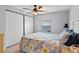 Well-lit bedroom with light-colored walls and a ceiling fan at 25931 Azalea Ln, Astatula, FL 34705