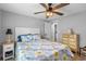 Cozy bedroom featuring bright, patterned bedding at 25931 Azalea Ln, Astatula, FL 34705
