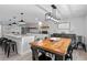 Kitchen and dining area with wood dining table and modern lighting at 25931 Azalea Ln, Astatula, FL 34705