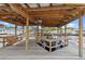 Covered dock with swing, dining area, and boat lift for all your waterfront desires at 25931 Azalea Ln, Astatula, FL 34705