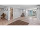 Spacious living room with wood-look floors and neutral walls at 25931 Azalea Ln, Astatula, FL 34705