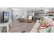 Bright, airy living space with bar seating, cozy armchairs, and a comfortable white sofa at 25931 Azalea Ln, Astatula, FL 34705