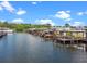 Canal view of waterfront homes, each with a private boat dock, providing direct access to the open water at 25931 Azalea Ln, Astatula, FL 34705