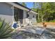The back patio features a concrete pad and two rocking chairs with an installed security system at 2613 Howland Blvd, Deltona, FL 32738