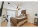 Serene bedroom with a ceiling fan, exercise bike, and a sliding door with natural light at 2613 Howland Blvd, Deltona, FL 32738