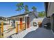 Side deck view of gray home with outdoor seating area at 2613 Howland Blvd, Deltona, FL 32738
