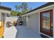 Outdoor deck area with comfortable seating and a view of the surrounding landscape at 2613 Howland Blvd, Deltona, FL 32738
